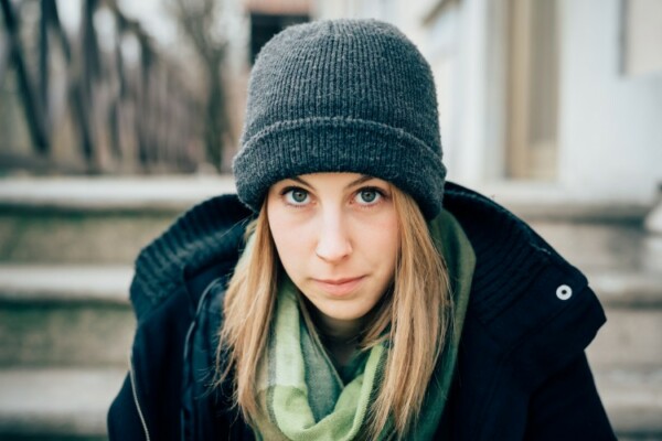 Woman wearing a grey beanie