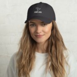 Woman wearing a grey firelark branded dad hat