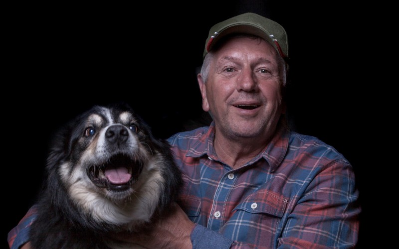 Man wearing a hat with his dog